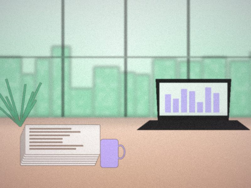 Bureau clair avec ordinateur portable affichant des graphiques et une plante verte